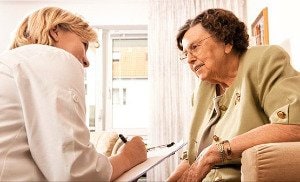 Doctor talking to eldery woman