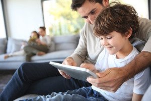 Dad with Son and Ipad